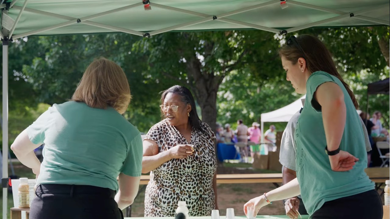 A first time taster at the Naturally Nectar table at Triad Park