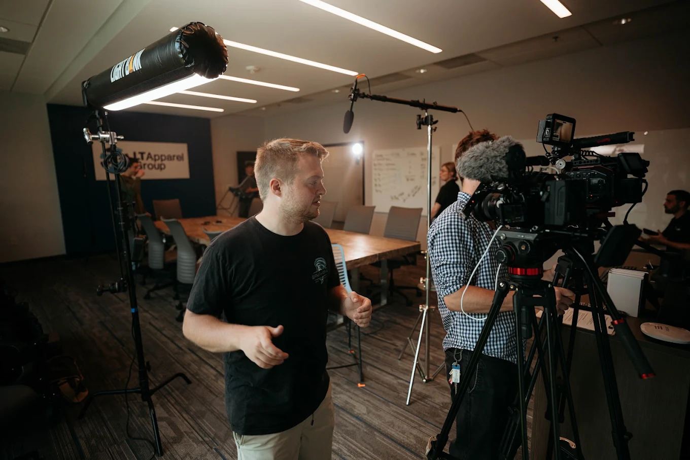 Dylan Smith directing an interview at LT Apparel